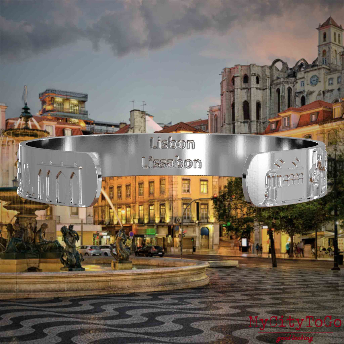 Innenseite eines versilberten Armreifs mit Reliefs bekannter Sehenswürdigkeiten der Stadt Lissabon und einer Gravur des Stadtnamens. Den Hintergrund bildet eine Ansicht der Stadt Lissabon.