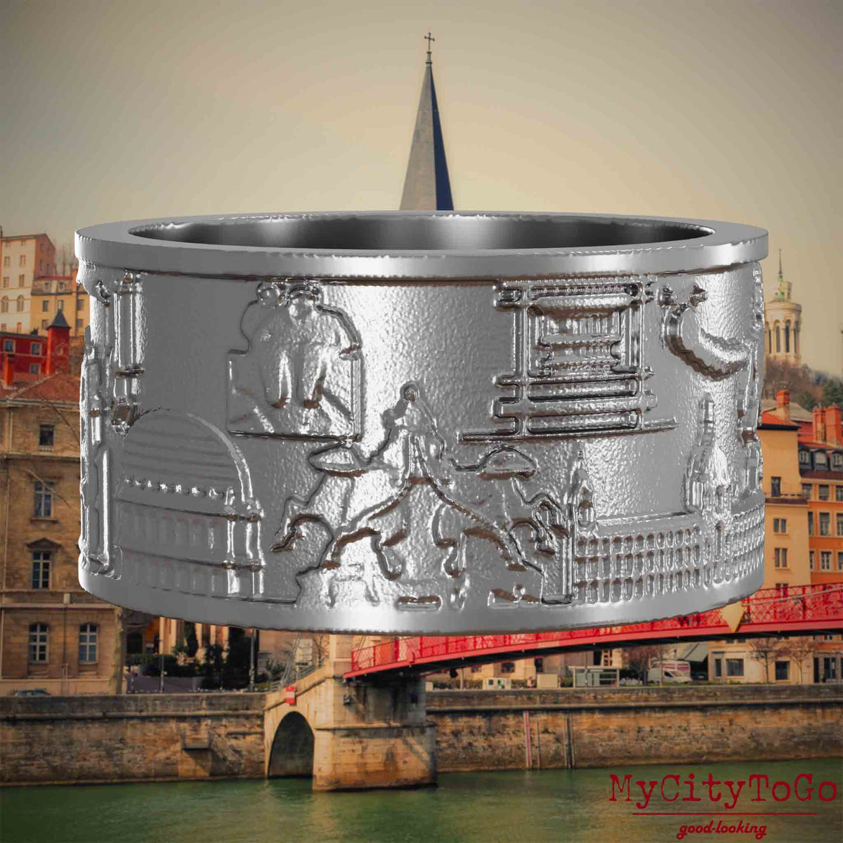 Ring aus Edelstahl mit Reliefs bekannter Sehenswürdigkeiten der Stadt Lyon. Den Hintergrund bildet eine Ansicht der Stadt Lyon.