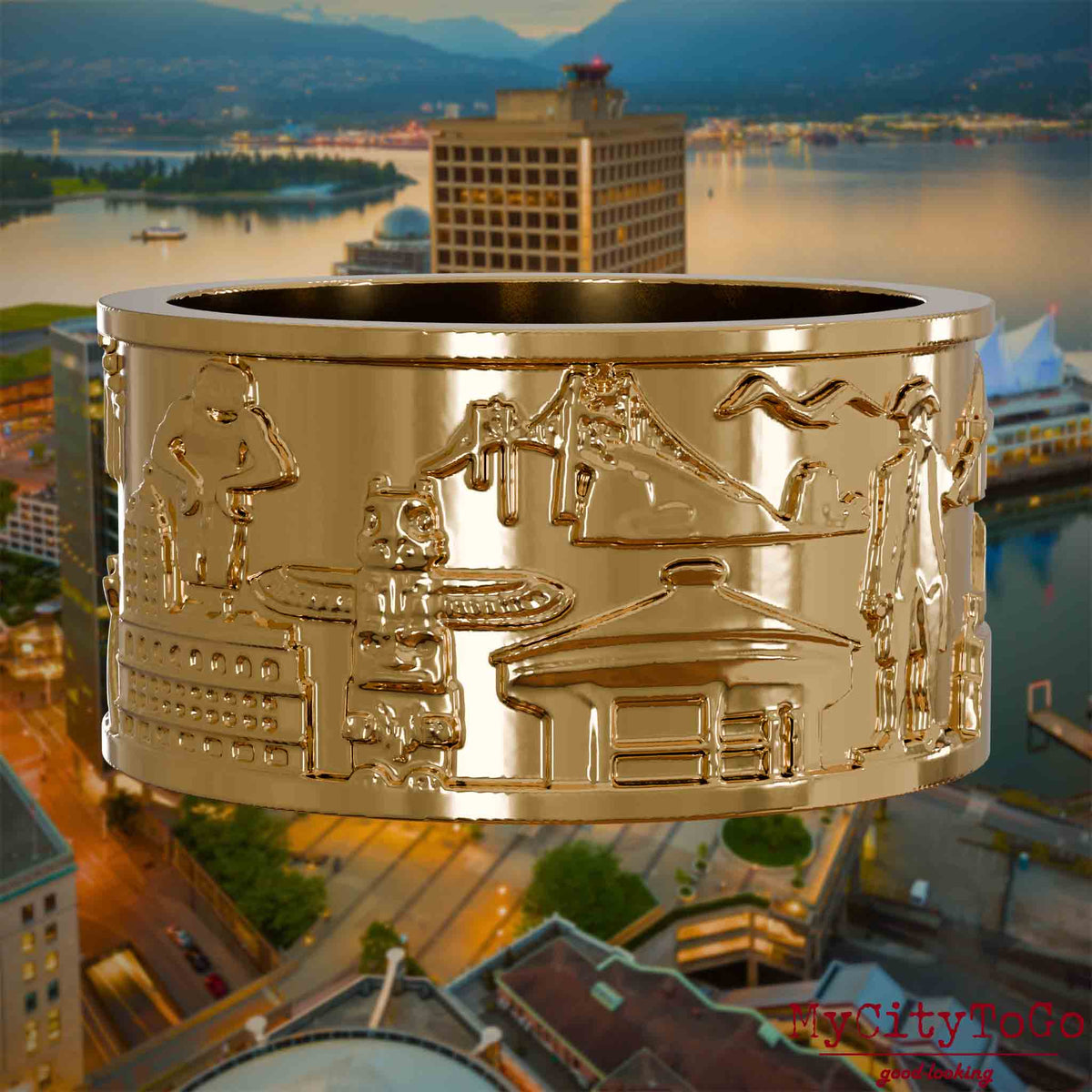 Vergoldeter Ring mit Reliefs bekannter Sehenswürdigkeiten der Stadt Vancouver. Den Hintergrund bildet eine Ansicht der Stadt Vancouver.