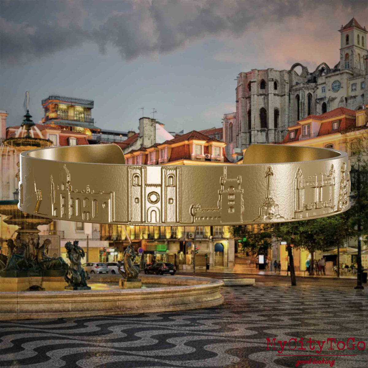 Armreif aus vergoldetem Edelstahl mit Reliefs bekannter Sehenswürdigkeiten der Stadt Lissabon. Den Hintergrund bildet eine Ansicht der Stadt Lissabon.