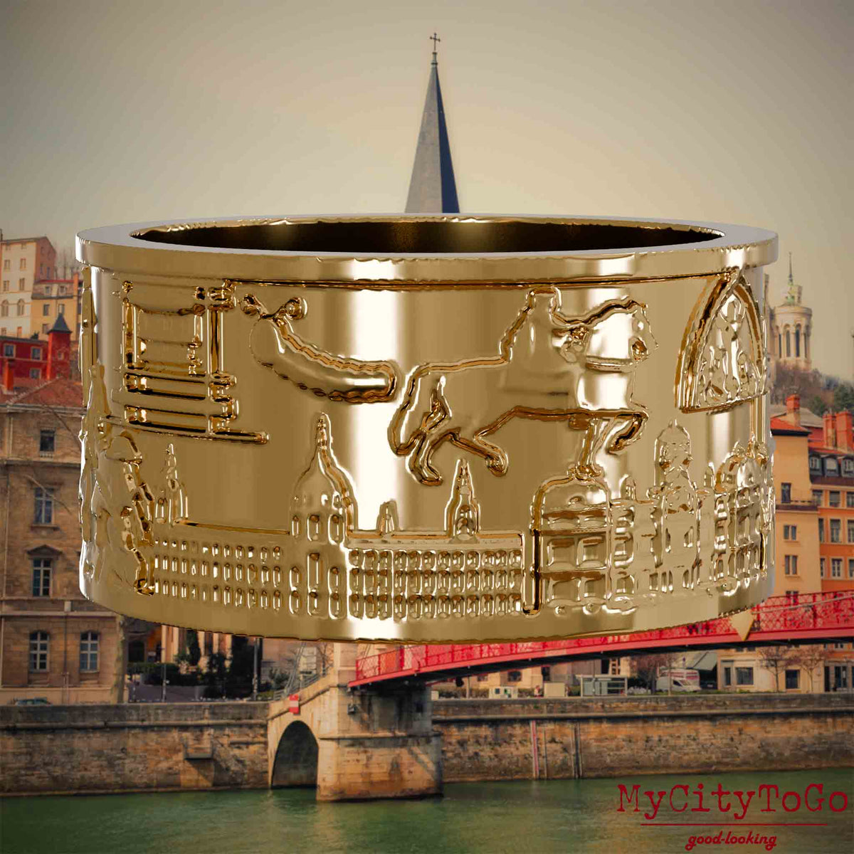 Vergoldeter Ring mit Reliefs bekannter Sehenswürdigkeiten der Stadt Lyon. Den Hintergrund bildet eine Ansicht der Stadt Lyon.