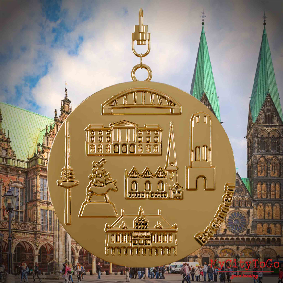 Halskette mit Drehwirbel und Vorderseite eines vergoldeten Schmuckanhängers, auf dem Reliefs bekannter Sehenswürdigkeiten der Stadt Bremen abgebildet sind. Den Hintergrund bildet eine Ansicht der Stadt Bremen.