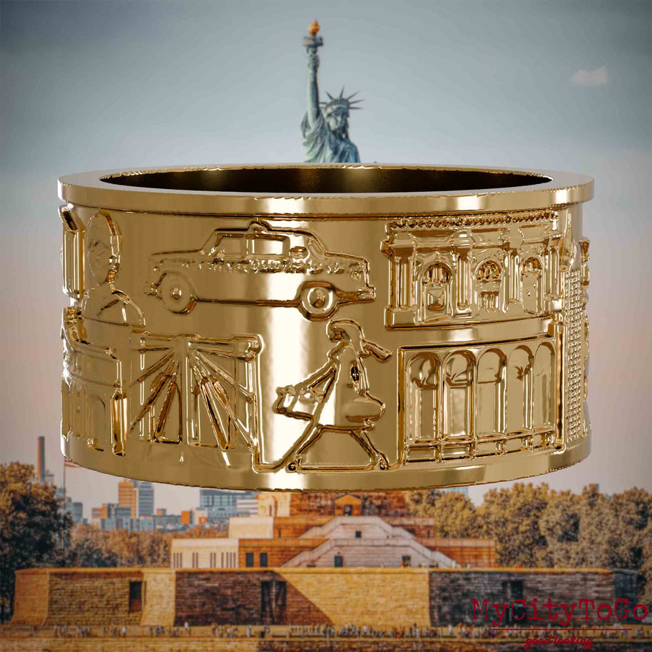 Vergoldeter Ring mit Reliefs bekannter Sehenswürdigkeiten der Stadt New York. Den Hintergrund bildet eine Ansicht der Stadt New York.