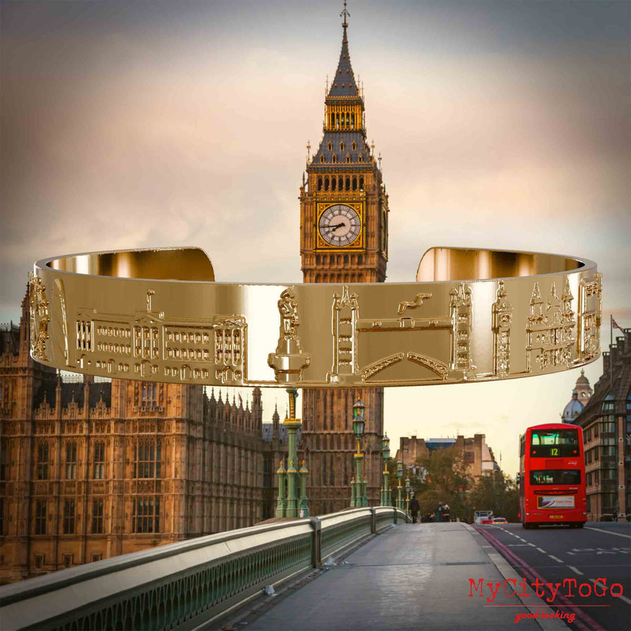 Vergoldeter Amreif mit Reliefs bekannter Sehenswürdigkeiten der Stadt London. Den Hintergrund bildet eine Ansicht der Stadt London.