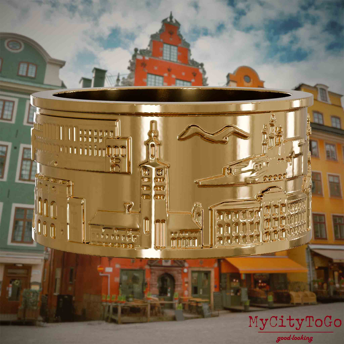 Vergoldeter Ring mit Reliefs bekannter Sehenswürdigkeiten der Stadt Stockholm. Den Hintergrund bildet eine Ansicht der Stadt Stockholm.