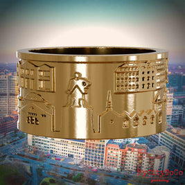 Vergoldeter Ring mit Reliefs bekannter Sehenswürdigkeiten der Stadt Essen. Den Hintergrund bildet eine Ansicht der Stadt Essen.