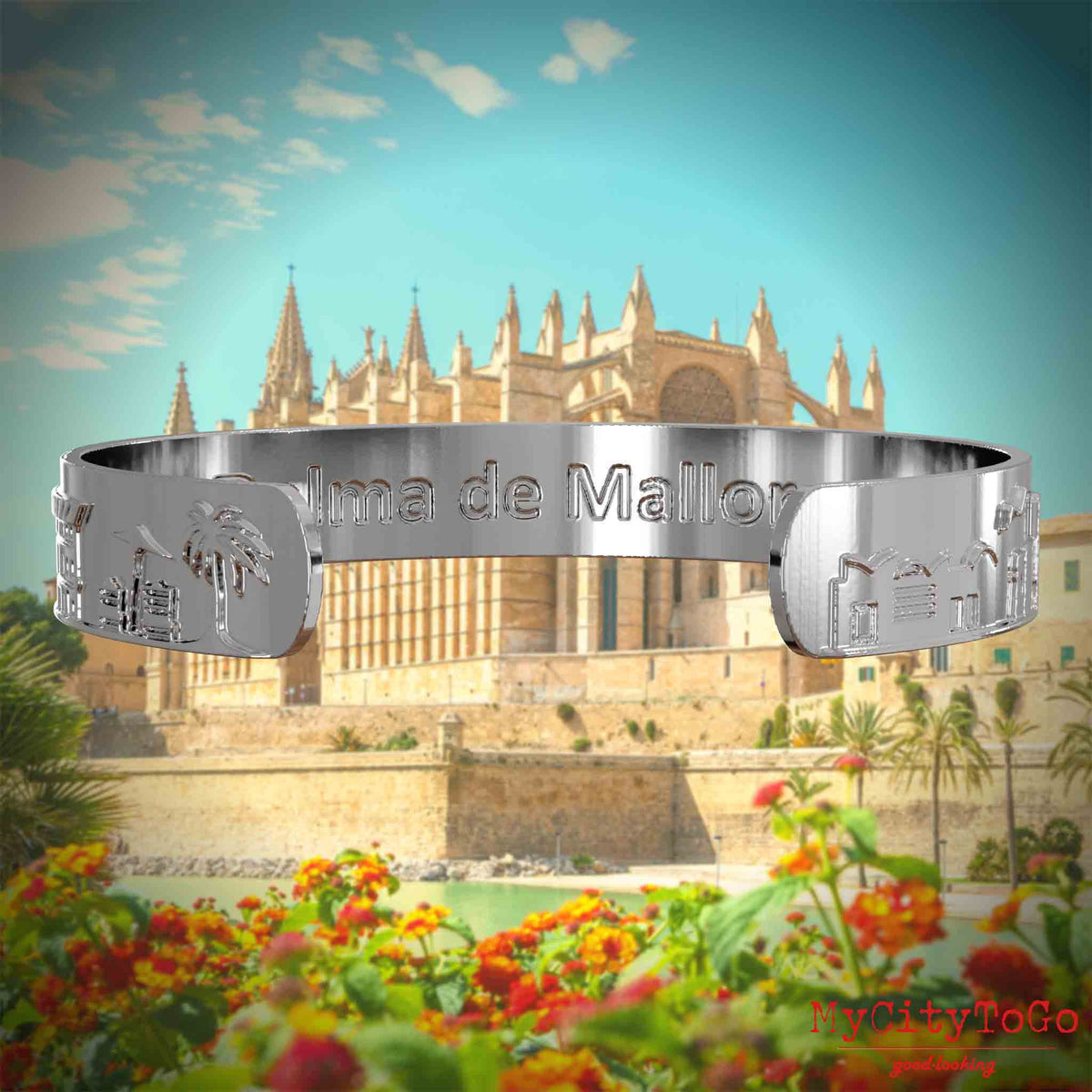 Innenseite eines silbernen Armreifs mit Reliefs bekannter Sehenswürdigkeiten der Stadt Palma de Mallorca und einer Gravur des Stadtnamens . Den Hintergrund bildet eine Ansicht der Stadt Palma de Mallorca.