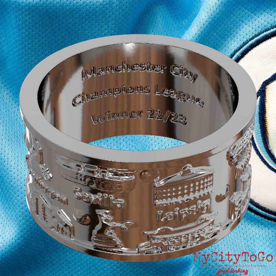 Versilberter Ring mit Reliefs bekannter Sehenswürdigkeiten der Spielorte und Stadien der Champions-League-Saison 2022/23 von Manchester City und der Gravur 
