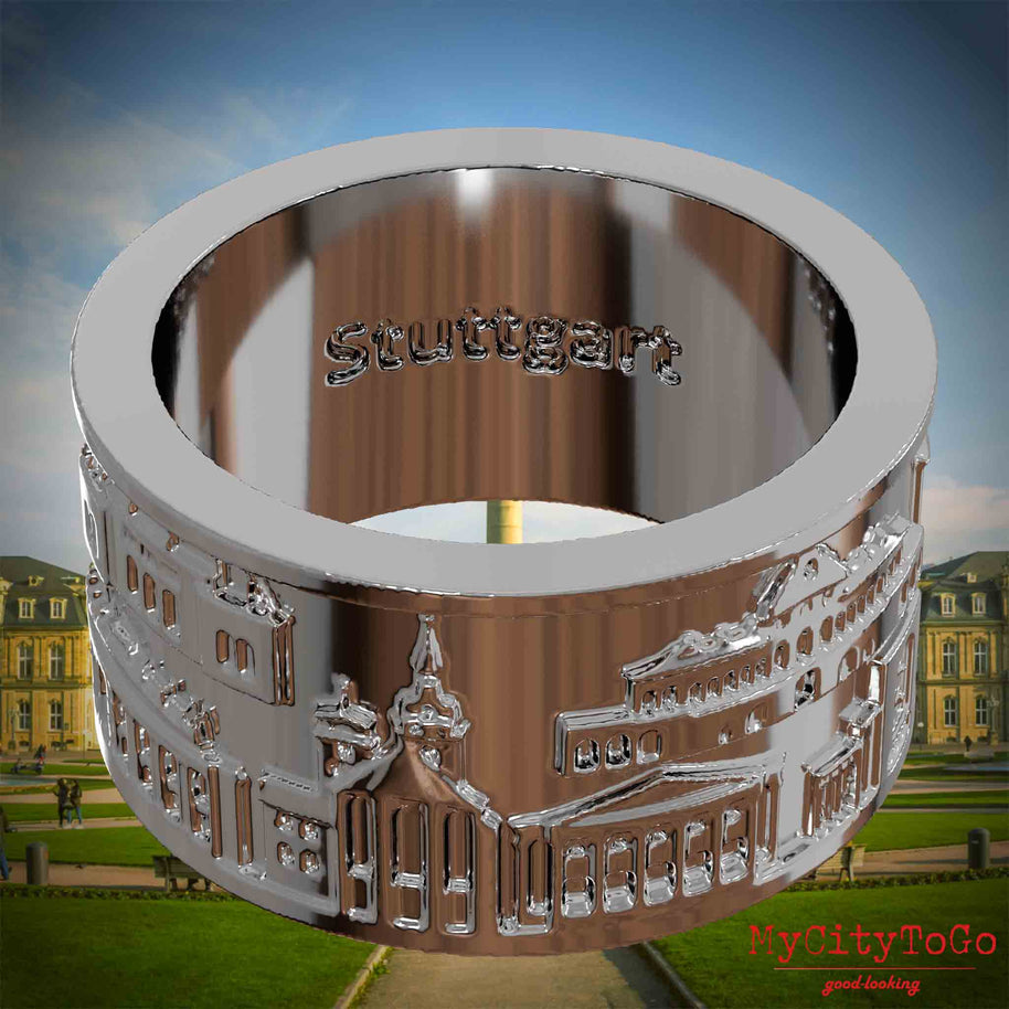 Versilberter Ring mit Reliefs bekannter Sehenswürdigkeiten der Stadt Stuttgart und einer Gravur des Stadtnamens auf der Innenseite. Den Hintergrund bildet eine Ansicht der Stadt Stuttgart.