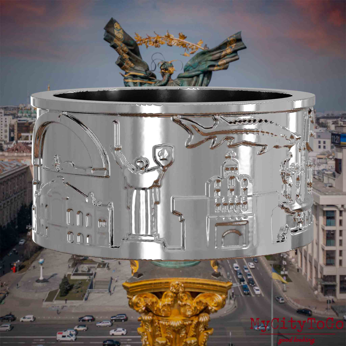 Silberner Ring mit Reliefs bekannter Sehenswürdigkeiten der Stadt Kiew. Den Hintergrund bildet eine Ansicht der Stadt Kiew.