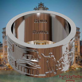 Versilberter Ring mit Reliefs bekannter Sehenswürdigkeiten der Stadt Rom und einer Gravur des Stadtnamens auf der Innenseite. Den Hintergrund bildet eine Ansicht der Stadt Rom.