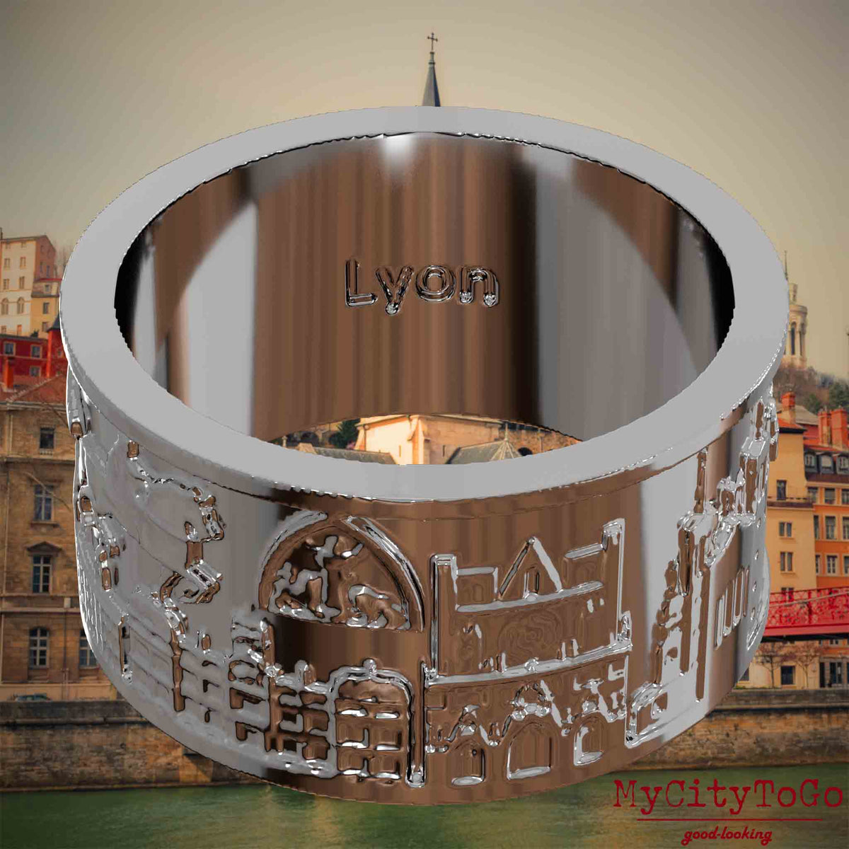 Versilberter Ring mit Reliefs bekannter Sehenswürdigkeiten der Stadt Lyon und einer Gravur des Stadtnamens auf der Innenseite. Den Hintergrund bildet eine Ansicht der Stadt Lyon.