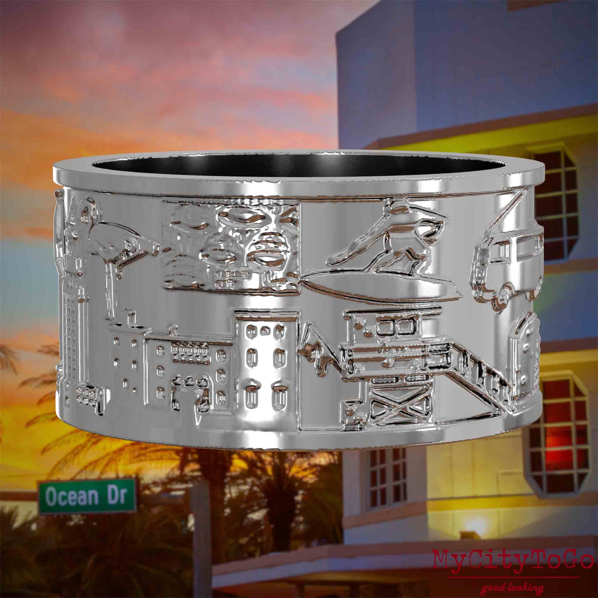 Silberner Ring mit Reliefs bekannter Sehenswürdigkeiten der Stadt Miami. Den Hintergrund bildet eine Ansicht der Stadt Miami.