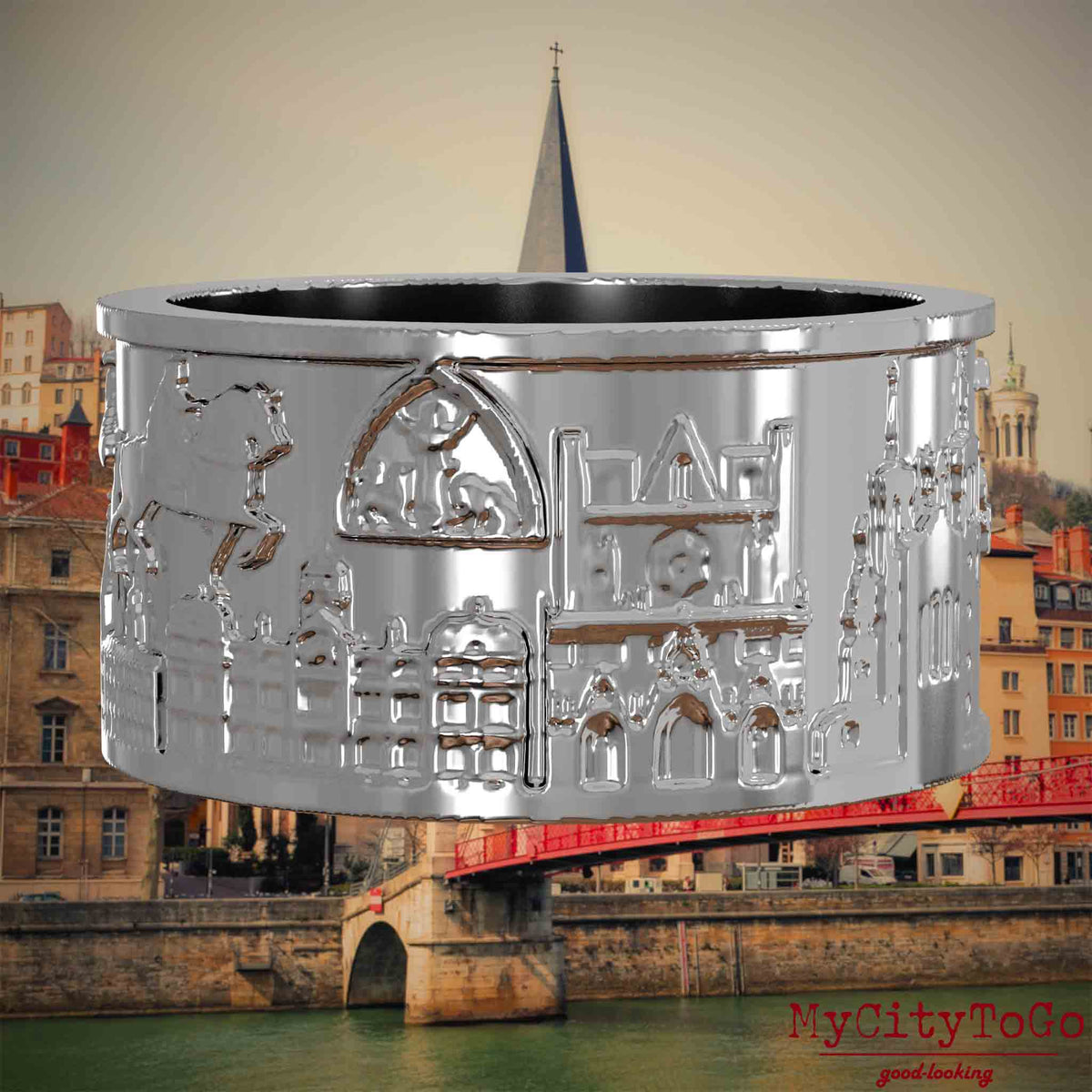 Silberner Ring mit Reliefs bekannter Sehenswürdigkeiten der Stadt Lyon. Den Hintergrund bildet eine Ansicht der Stadt Lyon.