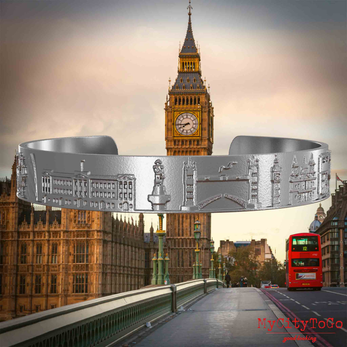 Amreif aus Edelstahl mit Reliefs bekannter Sehenswürdigkeiten der Stadt London. Den Hintergrund bildet eine Ansicht der Stadt London.