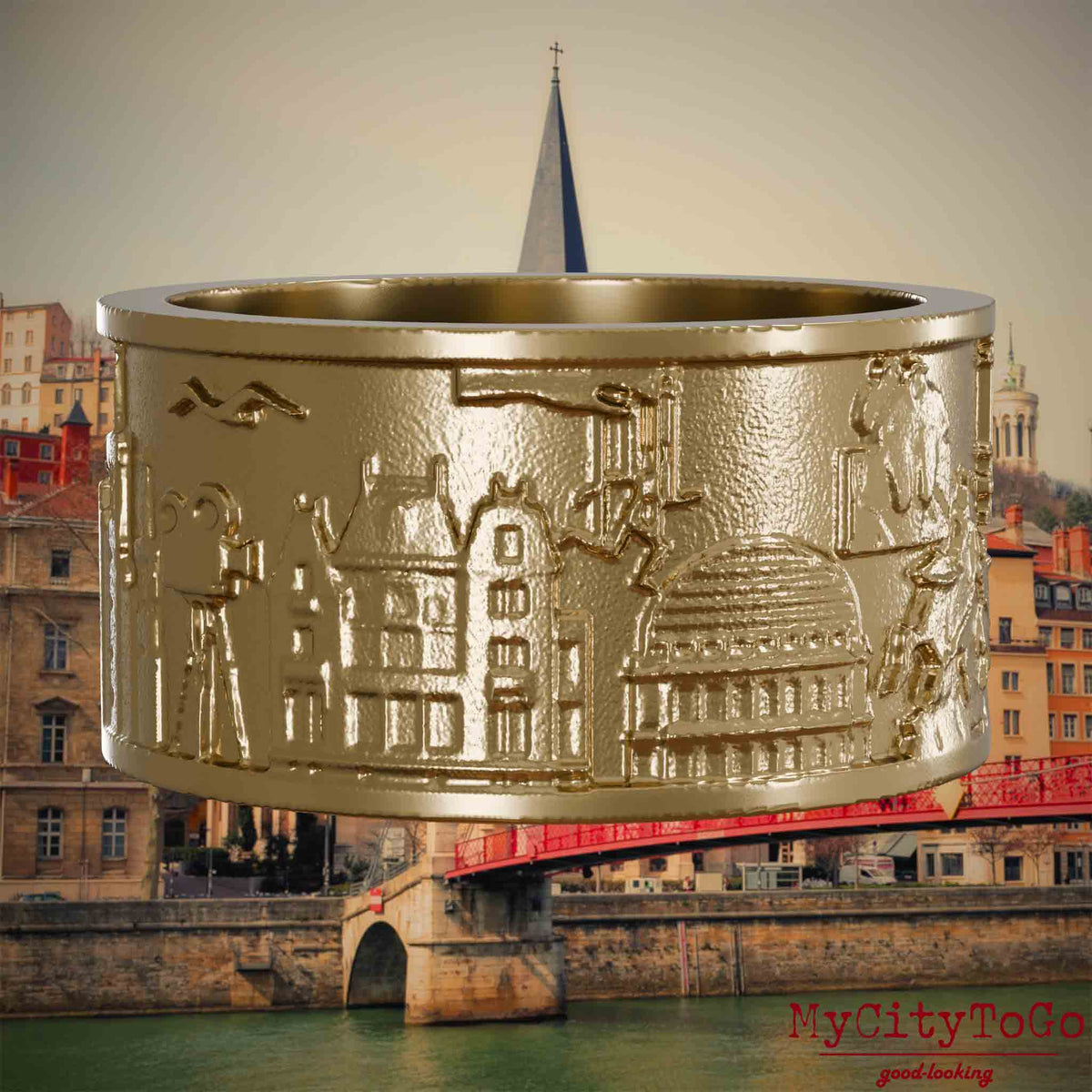 Ring aus vergoldetem Edelstahl mit Reliefs bekannter Sehenswürdigkeiten der Stadt Lyon. Den Hintergrund bildet eine Ansicht der Stadt Lyon.