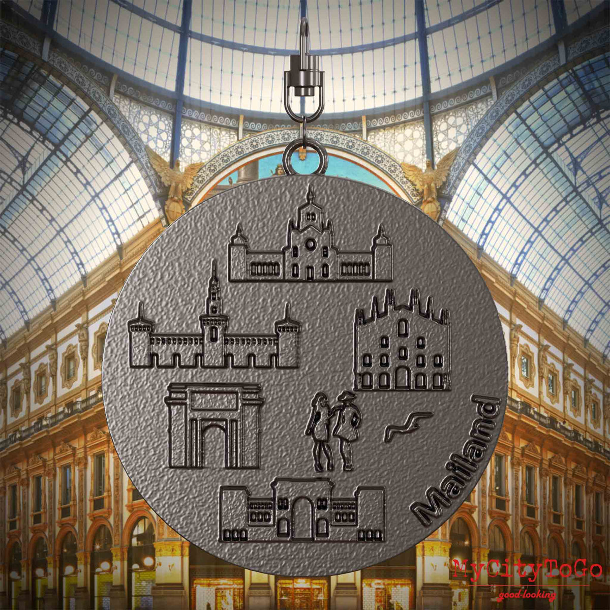 Halskette mit Drehwirbel und Rückseite eines Schmuckanhängers aus Titan, auf dem Reliefs bekannter Sehenswürdigkeiten der Stadt Mailand abgebildet sind. Den Hintergrund bildet eine Ansicht der Stadt Mailand.