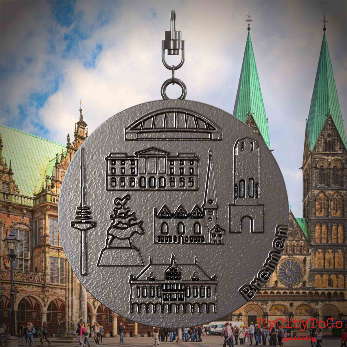 Halskette mit Drehwirbel und Vorderseite eines Schmuckanhängers aus Titan, auf dem Reliefs bekannter Sehenswürdigkeiten der Stadt Bremen abgebildet sind. Den Hintergrund bildet eine Ansicht der Stadt Bremen.