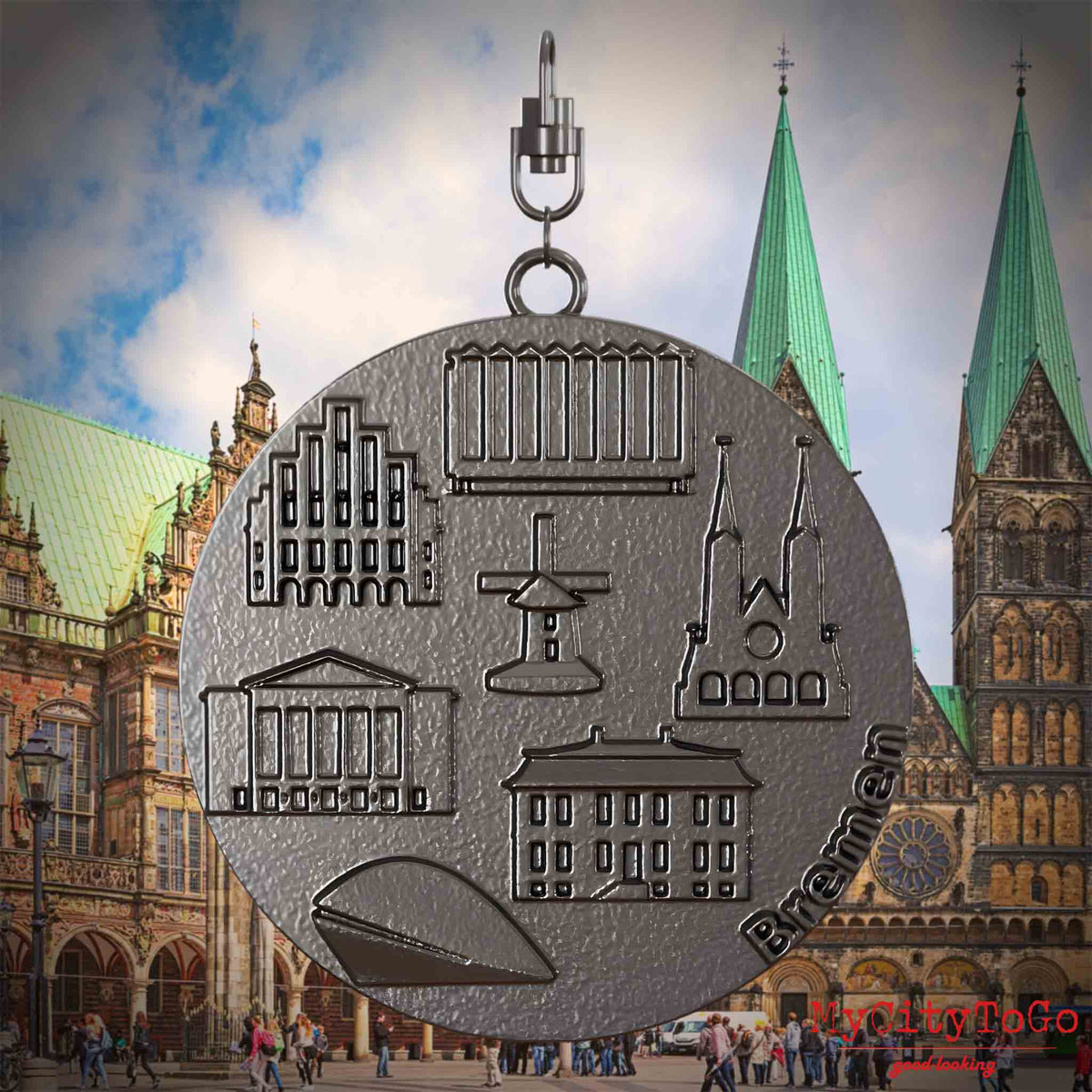 Halskette mit Drehwirbel und Rückseite eines Schmuckanhängers aus Titan, auf dem Reliefs bekannter Sehenswürdigkeiten der Stadt Bremen abgebildet sind. Den Hintergrund bildet eine Ansicht der Stadt Bremen.