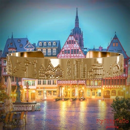 Vergoldeter Armreif mit Reliefs bekannter Sehenswürdigkeiten der Stadt Frankfurt. Den Hintergrund bildet eine Ansicht der Stadt Frankfurt.