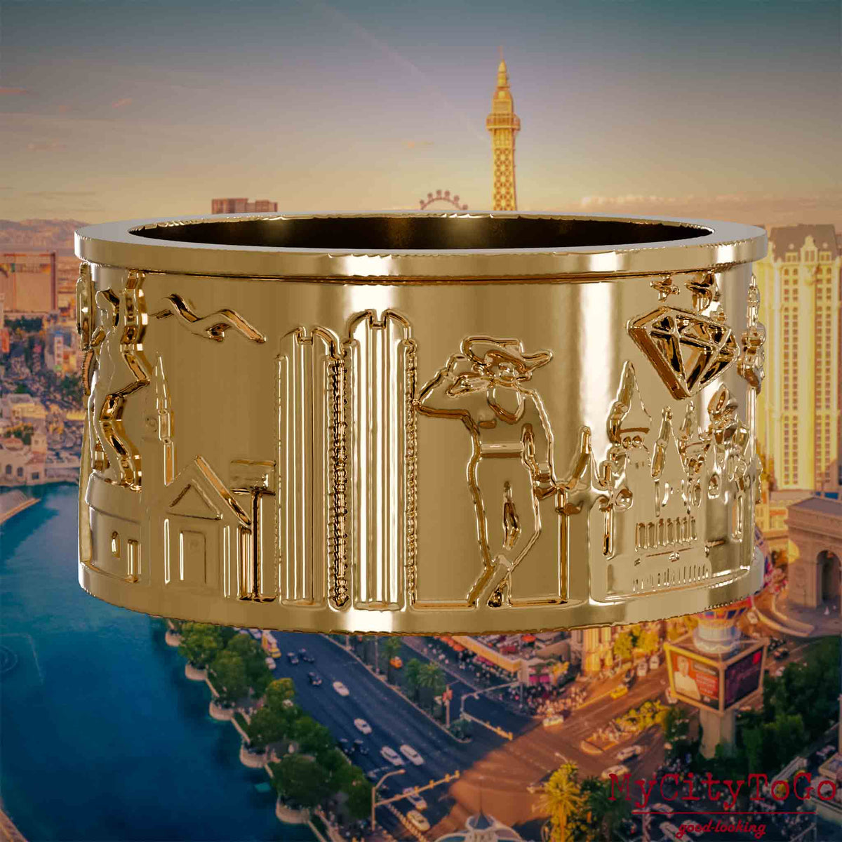 Vergoldeter Ring mit Reliefs bekannter Sehenswürdigkeiten der Stadt Las Vegas. Den Hintergrund bildet eine Ansicht der Stadt Las Vegas.