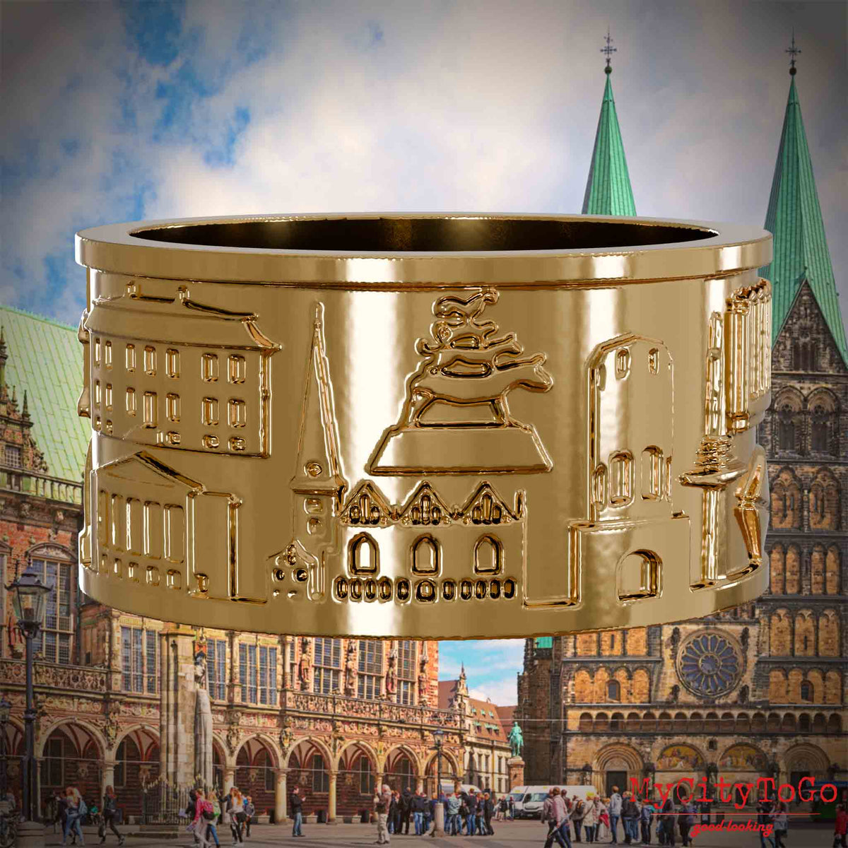 Vergoldeter Ring mit Reliefs bekannter Sehenswürdigkeiten der Stadt Bremen. Den Hintergrund bildet eine Ansicht der Stadt Bremen.