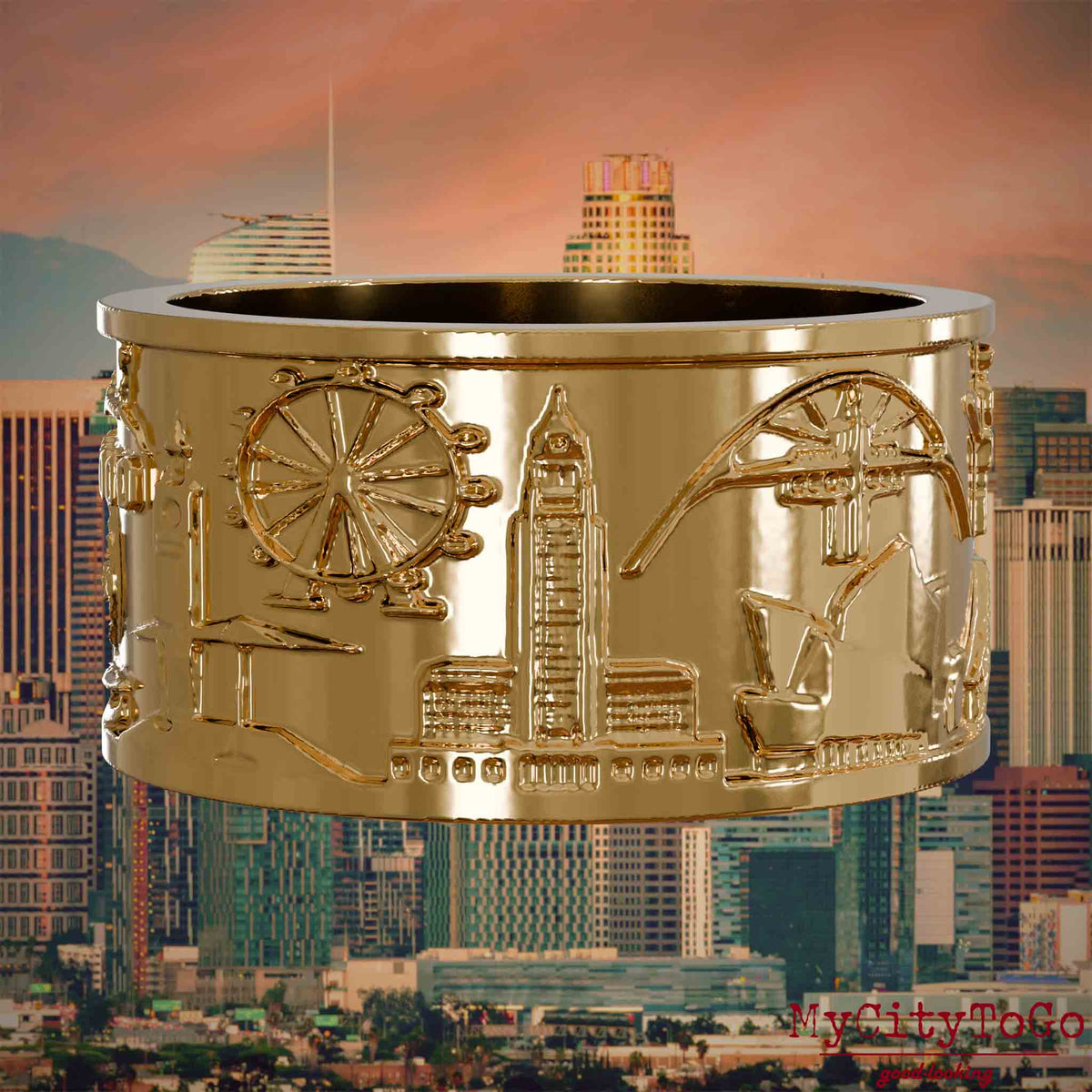 Vergoldeter Ring mit Reliefs bekannter Sehenswürdigkeiten der Stadt Los Angeles. Den Hintergrund bildet eine Ansicht der Stadt Los Angeles.