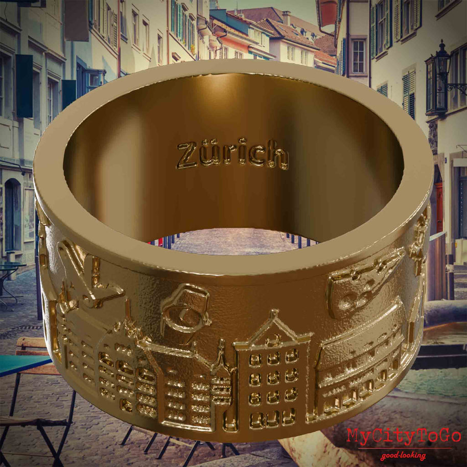 Ring aus vergoldetem Edelstahl mit Reliefs bekannter Sehenswürdigkeiten der Stadt Zuerich und einer Gravur des Stadtnamens auf der Innenseite. Den Hintergrund bildet eine Ansicht der Stadt Zuerich.